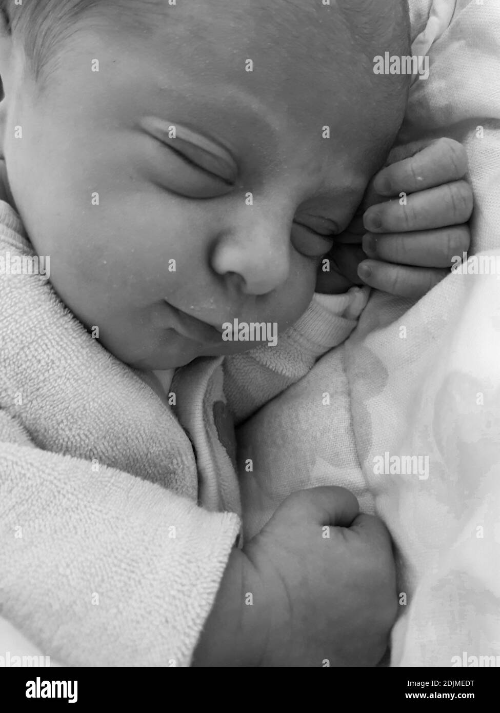 Sleeping newborn baby on bed Black and White Stock Photos & Images Alamy