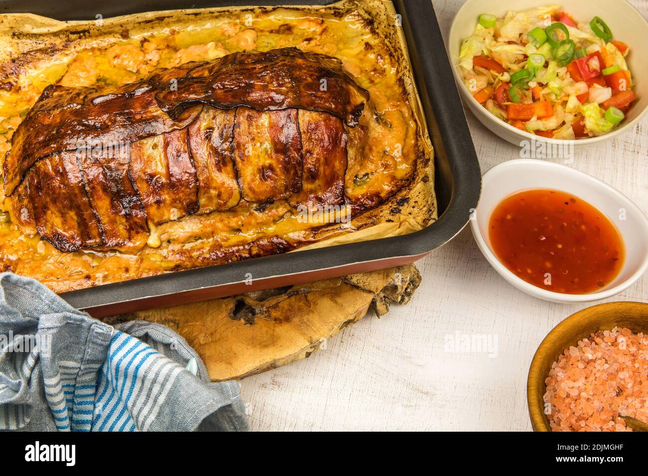 Baked minced meat with chili spices and sausage. Making classic