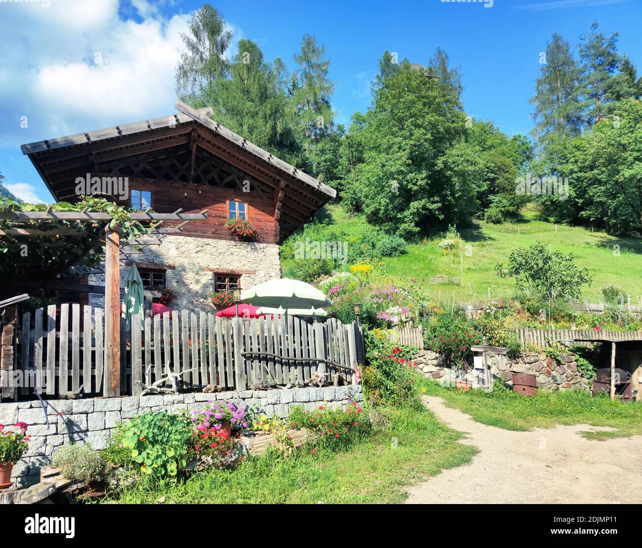 Mountain farmhouse and tavern with terrace in the South Tyrolean Ulten Valley Stock Photo