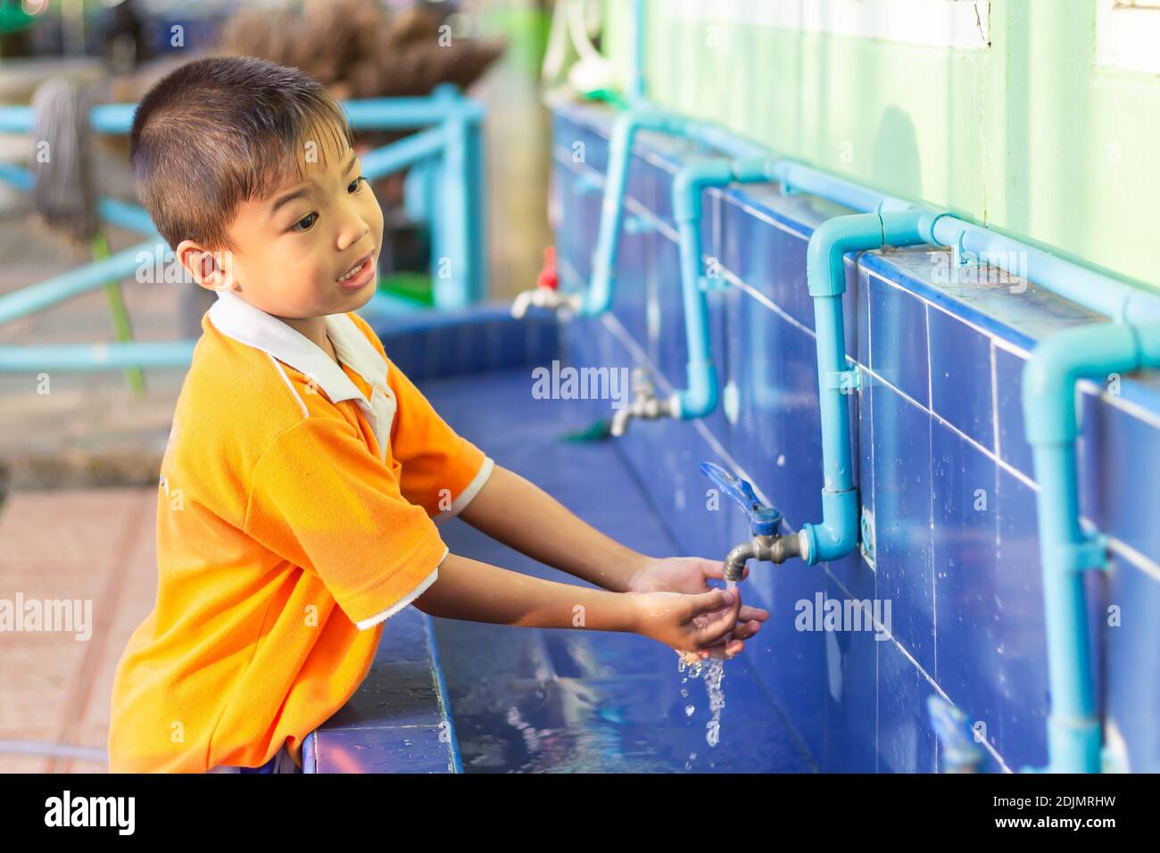Asian child Washes. Boys washing
