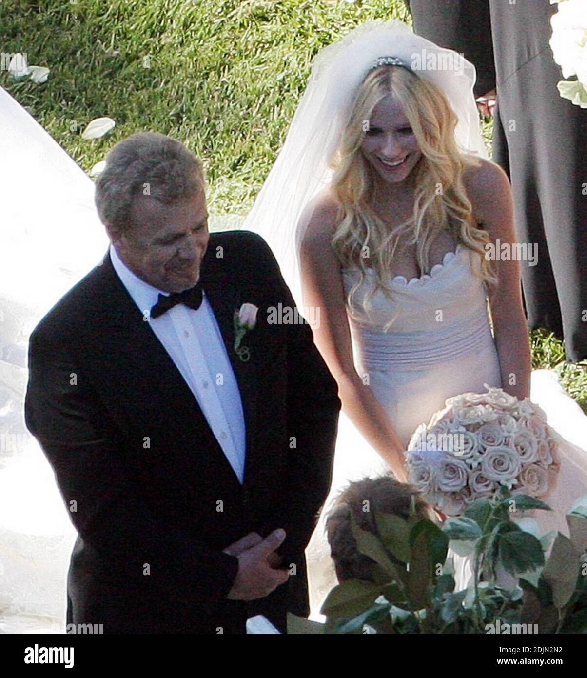 avril lavigne married her sweetheart deryck whibley in an romantic outdoor non denominational ceremony on saturday at 5pm at a private estate in montecito ca the bride wearing a vera wang gown a veil and holding a bouquet of white roses walked over rose petals with her father john at her arm while a string orchestra played mendelssohns wedding march the canadian rocker was surrounded by 110 close friends and family including guests from her hometown in ontario a cocktail hour and sit down meal followed the emotional exchange of vows the newlyweds first dance was to the goo goo d 2DJN2N2
