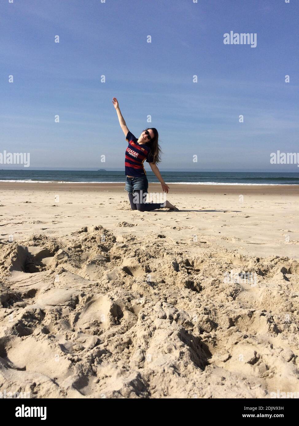 Person kneeling with arm raised hi-res stock photography and images - Alamy