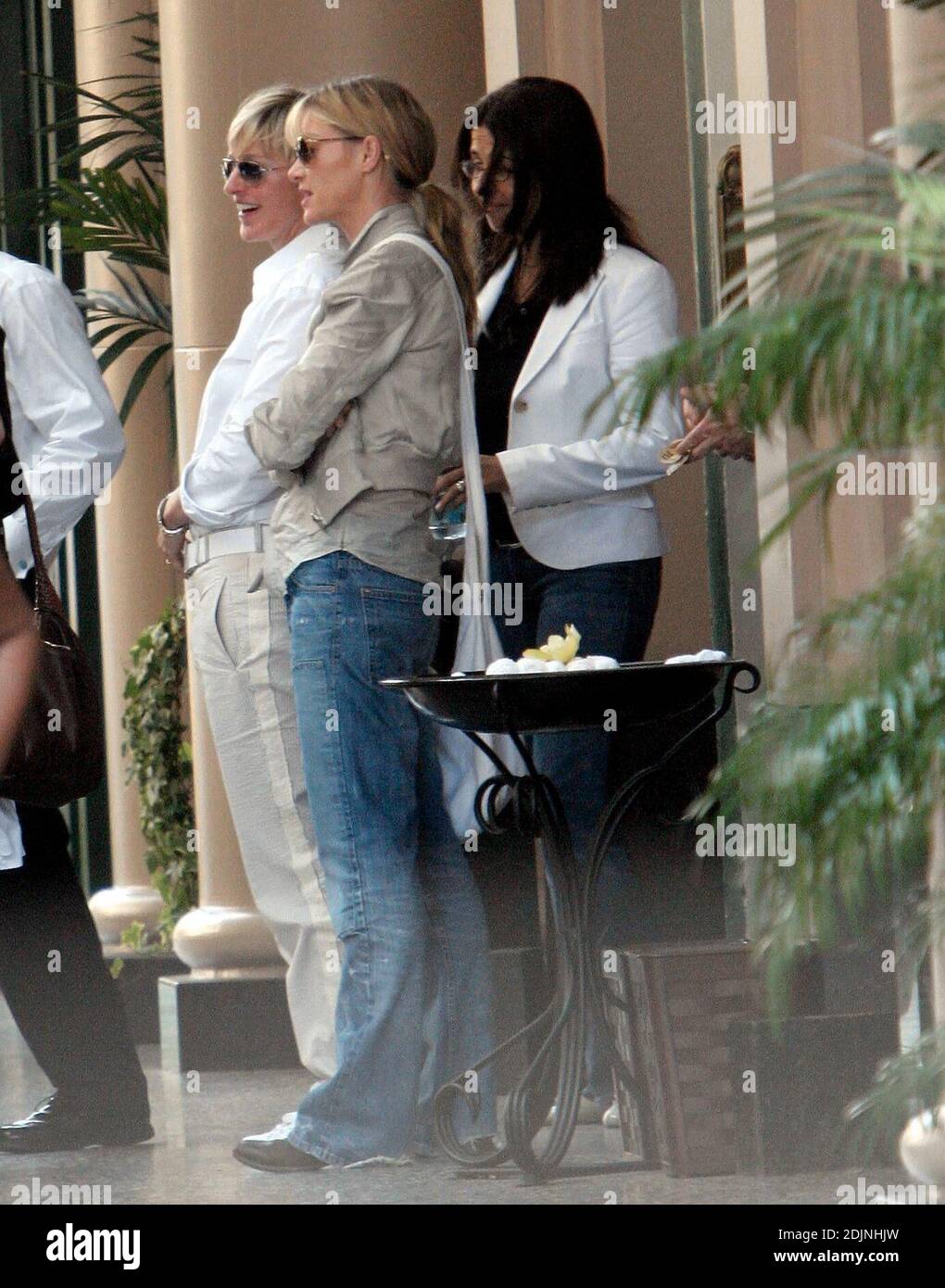 Exclusive!! Ellen DeGeneres and girlfriend Portia de Rossi leave the Regent Beverly Wilshire Hotel in Beverly Hills, Ca. The girls were all smiles as they said farewell to friends and sped off in the Porsche that Portia bought for Ellen for Christmas. 8/2/06 Stock Photo