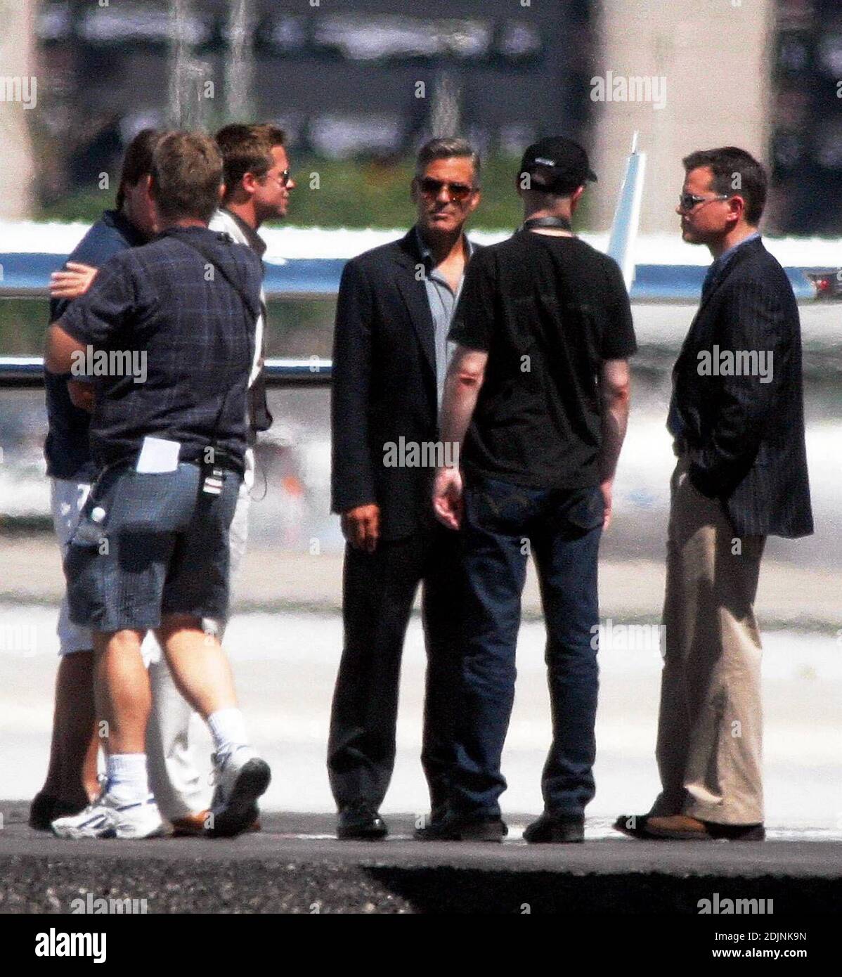 The boys are together again. Brad Pitt, George Clooney and Matt Damon were reunited on the Ocean's Thirteen set in Las Vegas, NV on Monday. The power trio were filming scenes at a local airport and made time in between takes to laugh and joke with eachother. The cast had to contend with soaring temperatures in excess of 110 degrees. 8/7/06 Stock Photo