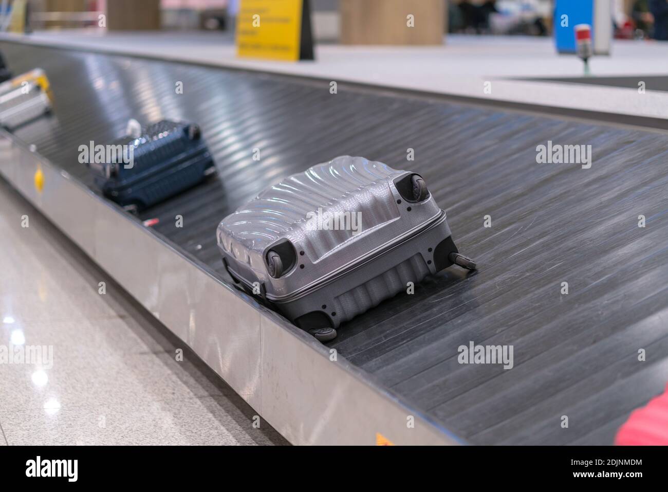 Luggage on airport conveyor belt hires stock photography and images