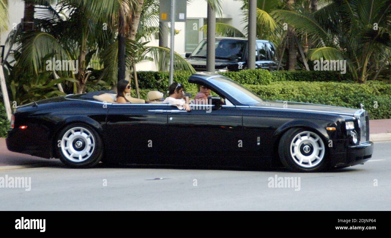 Paris Hilton accessories Scott Storch, Brandon Davis and Kimberly Kardashian live it large in a convertible Bentley, but when it comes to lunch they hit the neighborhood kebab shop beside Paris' swish hotel, 8/15/06 Stock Photo