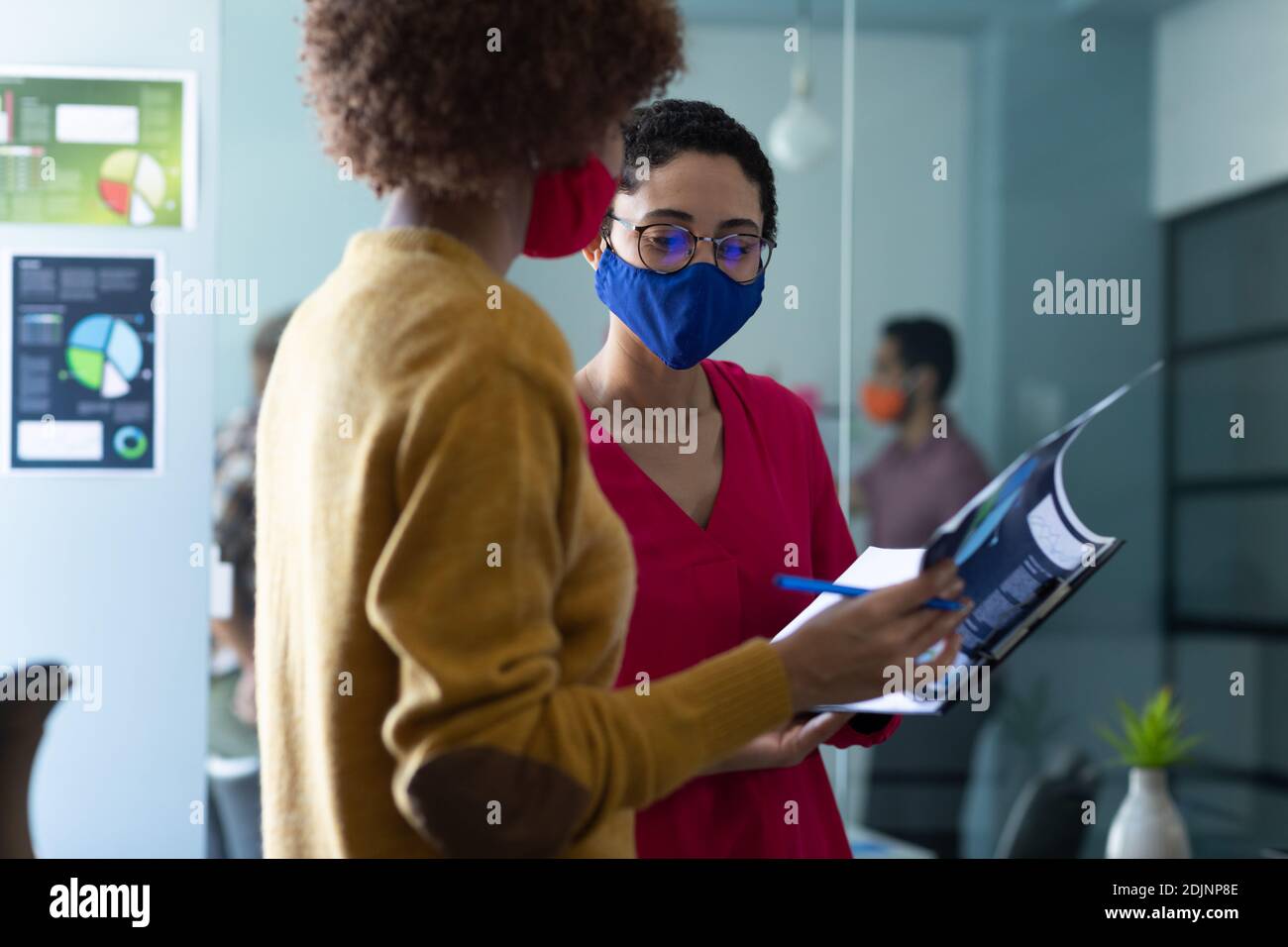 Two women wearing masks hi-res stock photography and images - Alamy