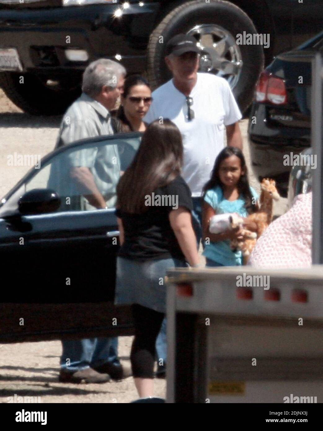 Matt Damon brings his family along to the set of Oceans Thirteen filming in Los Angeles, Ca. including his 2 month old daughter Isabella. He had a broad smile on his face when he helped lift the newborn out of the car. He also spent time with his wife Luciana's daughter Alexa, holding her hand as he showed her around the base camp. 8/24/06 Stock Photo