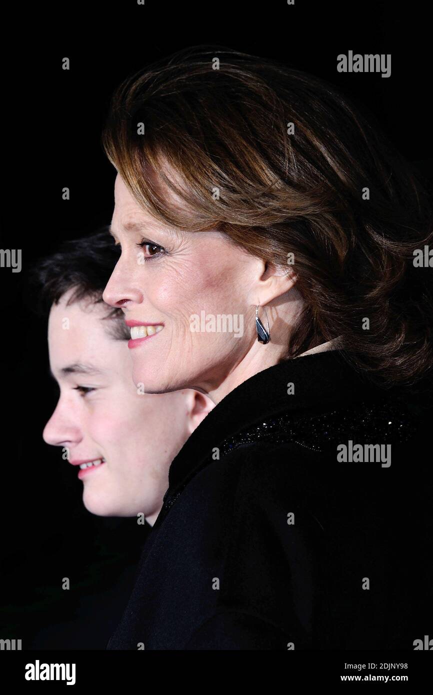 Lewis MacDougall and Sigourney Weaver attending the premiere of A ...