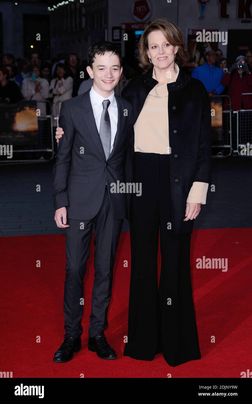 Lewis MacDougall and Sigourney Weaver attending the premiere of A ...