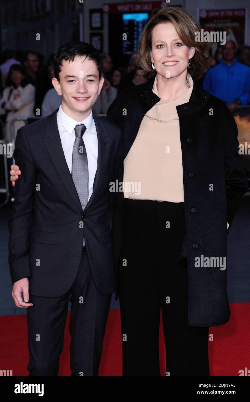 Lewis MacDougall and Sigourney Weaver attending the premiere of A ...