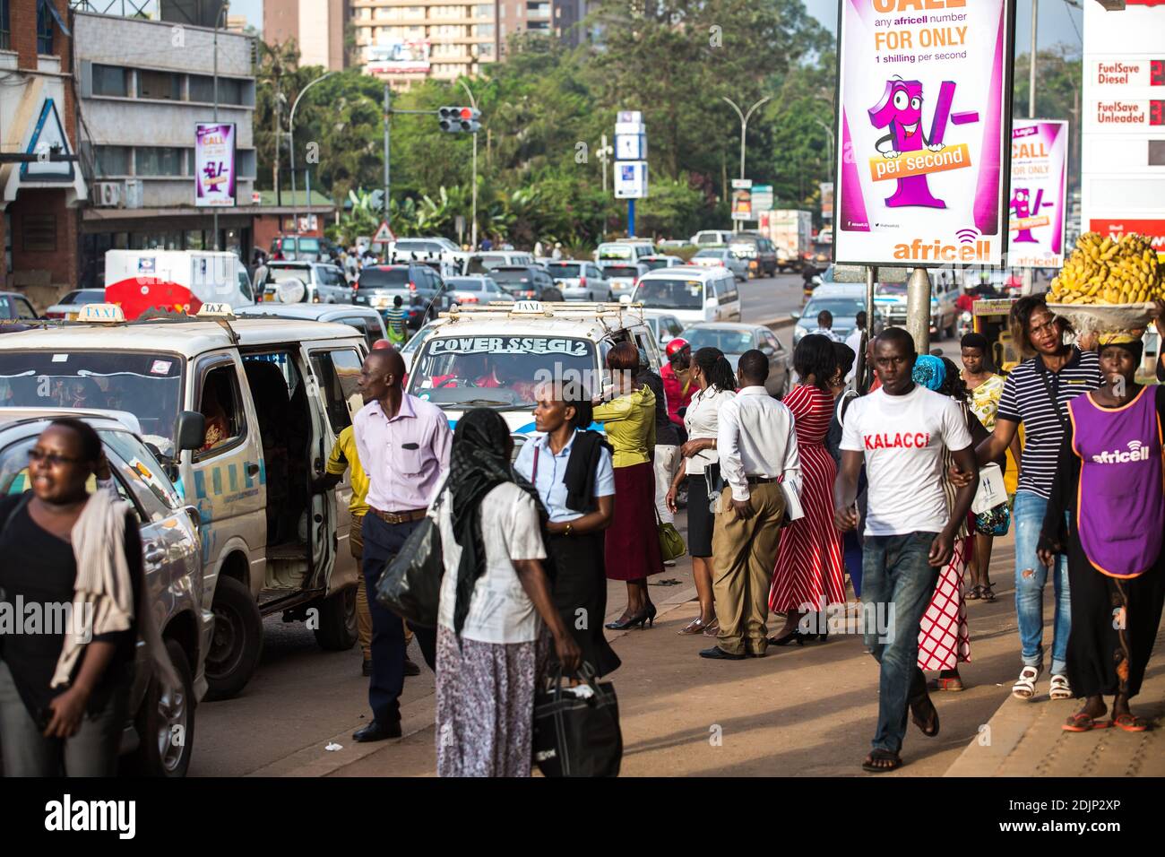 People at the bus stop. Daily life in Kampala, Uganda. Stock Photo