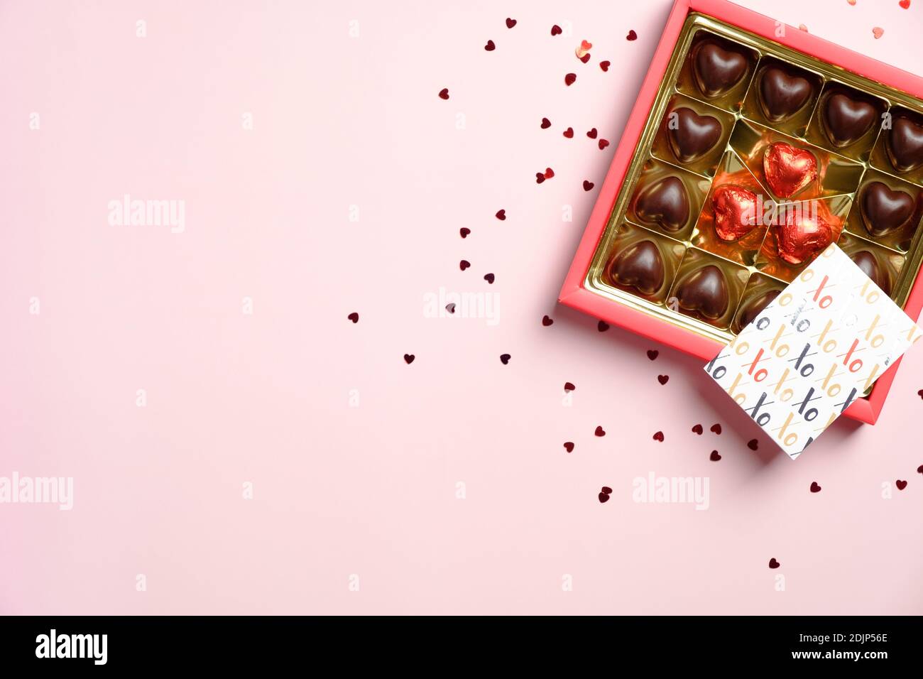 heart shape chocolate box red confetti and greeting card on pink table valentines day card template flat lay top view copy space stock photo alamy