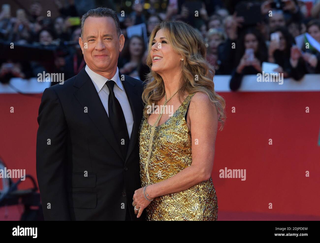 US Actor Tom Hanks arrives with his wife Rita Wilson on the red carpet