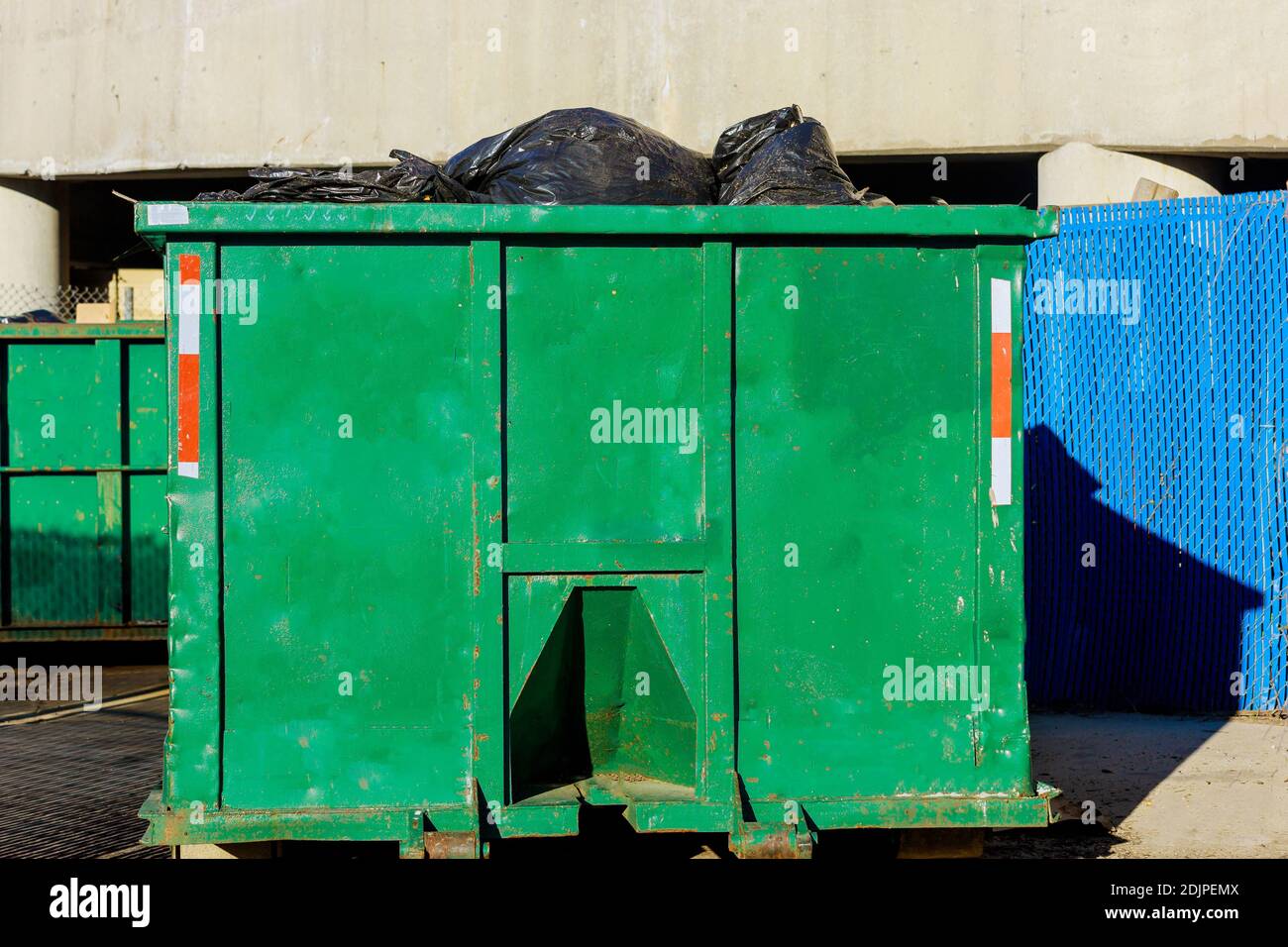 Recycling container trash dumpsters being with garbage construction trash Stock Photo Alamy