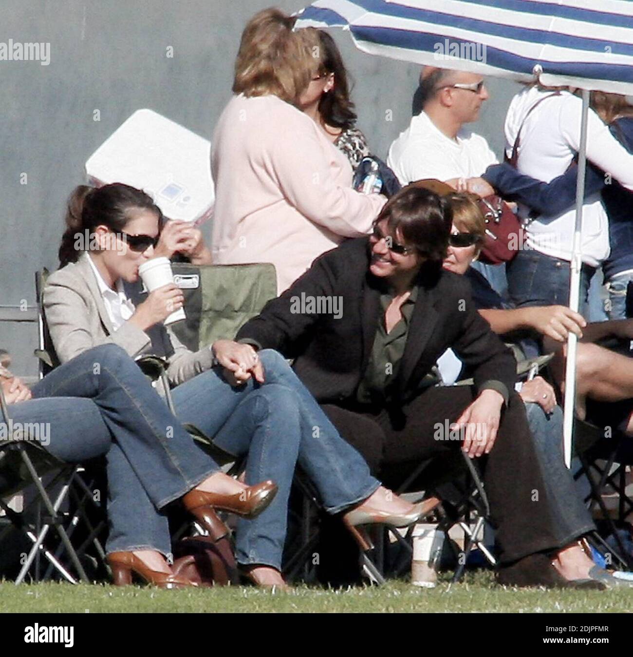 Tom Cruise and Katie Holmes watch Bella in a soccer match in Beverly Hills,  Ca. A slim Katie showed off her post-baby belly when the wind lifted her  blouse briefly. The happy