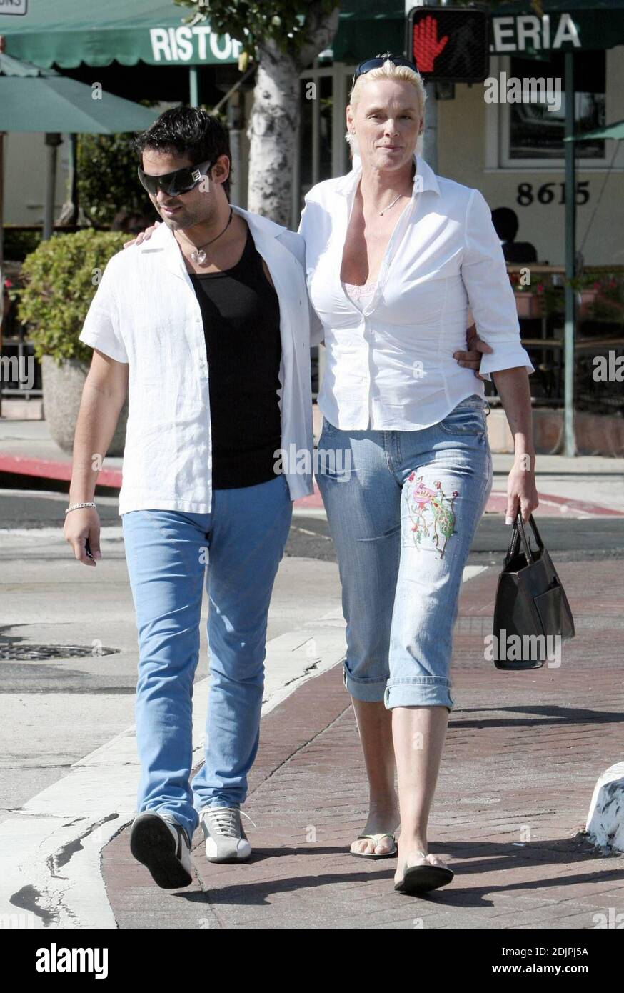 Exclusive!!  Bridget Nielsen and her fifth husband, Mattia Dessi, appear to be in good spirits after their lunch at Cafe Med in West Hollywood, Ca. 9/23/06 Stock Photo