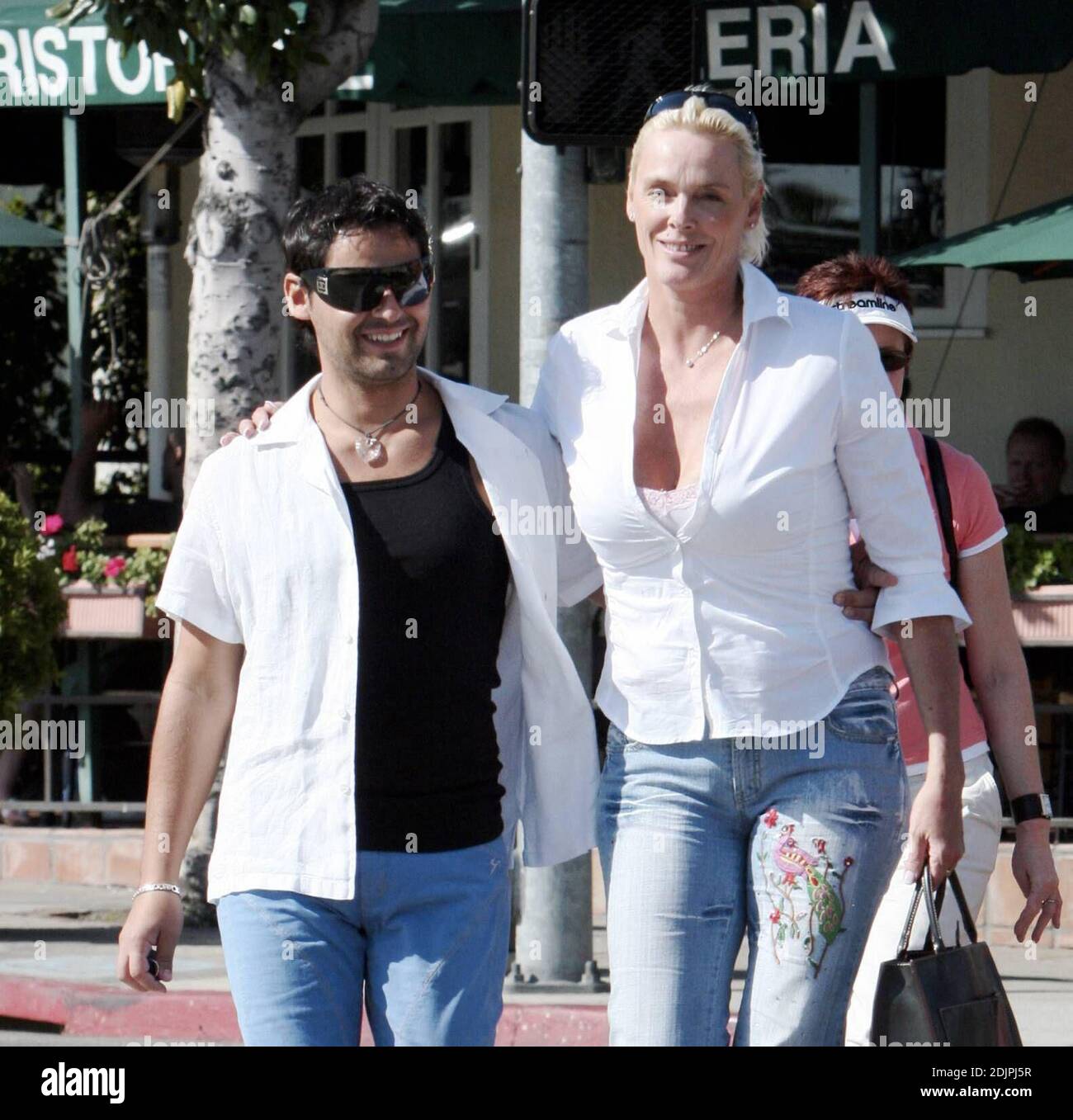 Exclusive!!  Bridget Nielsen and her fifth husband, Mattia Dessi, appear to be in good spirits after their lunch at Cafe Med in West Hollywood, Ca. 9/23/06 Stock Photo
