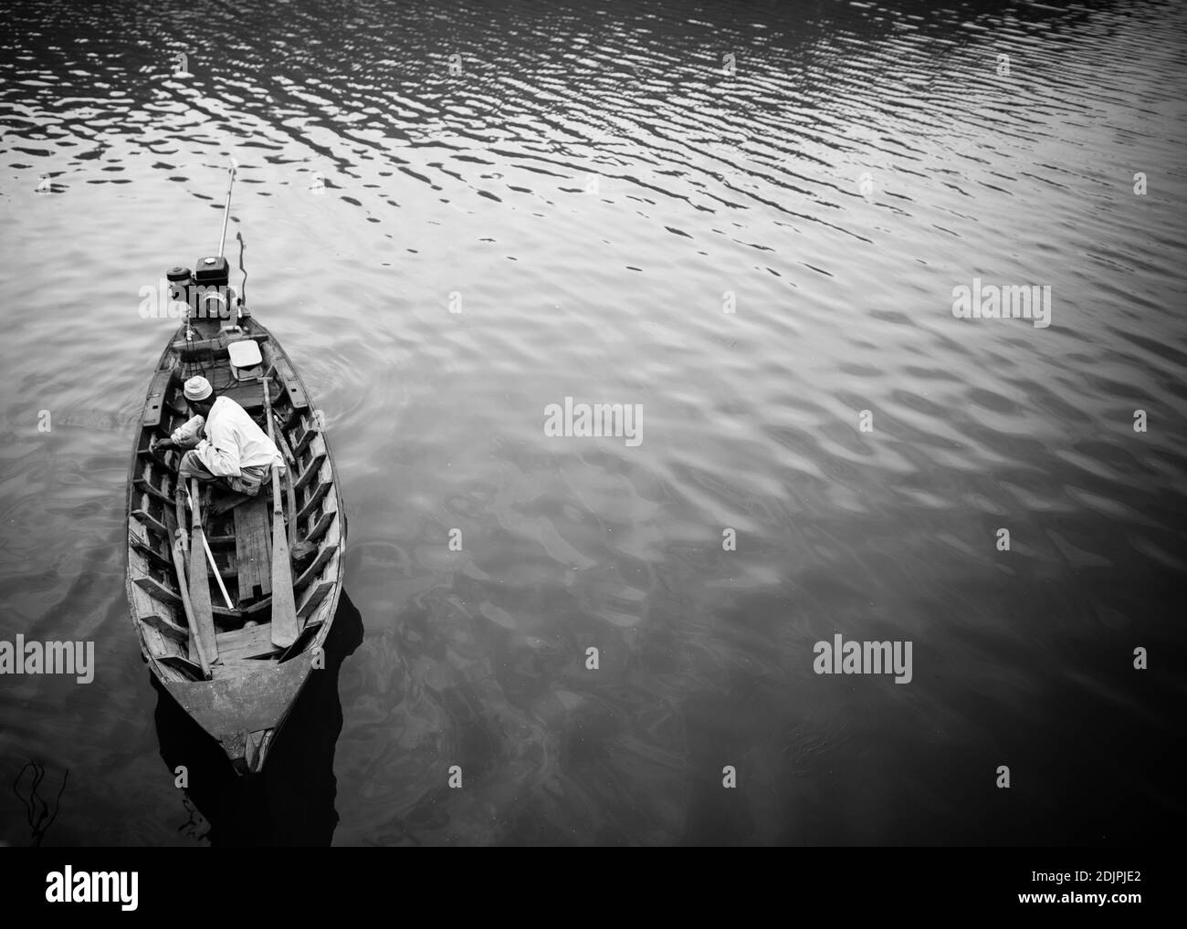 Man in fishing boat Black and White Stock Photos & Images - Alamy