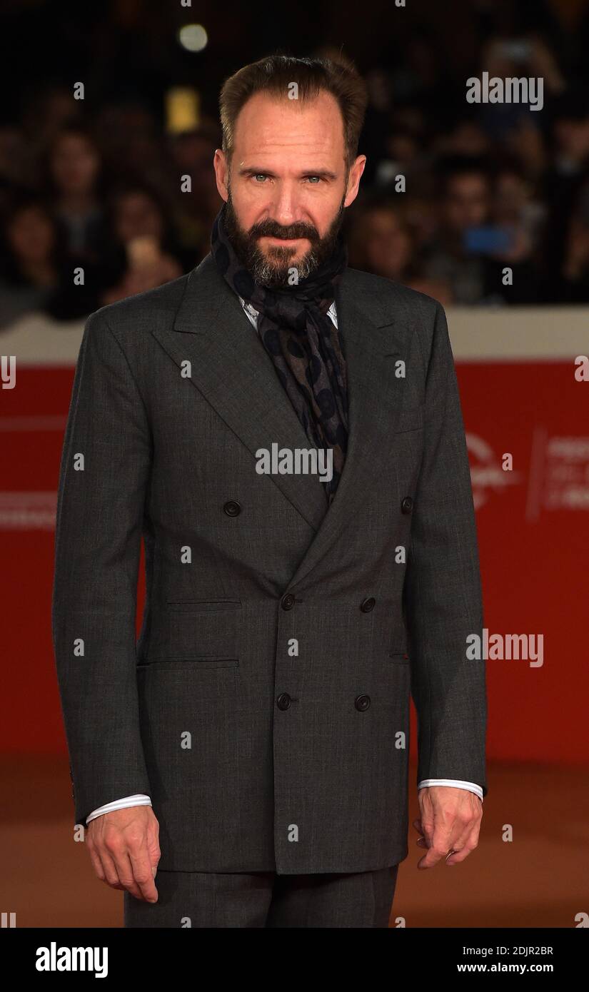 British actor Ralph Fiennes poses on the red carpet as she arrives for ...