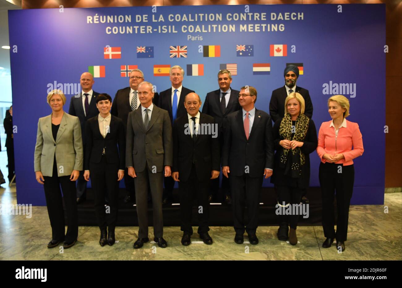 French Minister of Defence Jean-Yves Le Drian poses for a family photo with the Defence Ministers of the Coalition in Iraq and Syria, Ashton Carter (USA), Michael Fallon (UK), Jeanine Hennis-Plasschaert (Netherlands), Marise Payne (Australia), Roberta Pinotti (Italy), Ursula Von Der Leyen (Germany), Pedro Morenes (Spain), Peter Christensen (Denmark), Ine Marie Eriksen Soreide (Norway), Steven Vandeput (Belgium), Gerry Brownlee (New Zealand) and Harjit Sajjan (Canada), during the opening of a Counter-ISIL Coalition Meeting held at the French Ministry of Defence's headquarters in Paris, France o Stock Photo