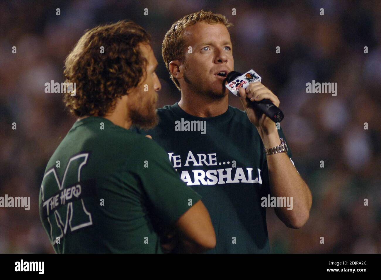 We Are Marshall film director McG addresses the Marshall Thundering Herd home crowd alongside star Matthew McConaughey prior to showing a small clip from the upcoming Warner Brothers film Wednesday, 10/4/06 at halftime of the Marshall University game against Central Florida at Joan C. Edwards Stadium in Huntington, West Virginia. Stock Photo