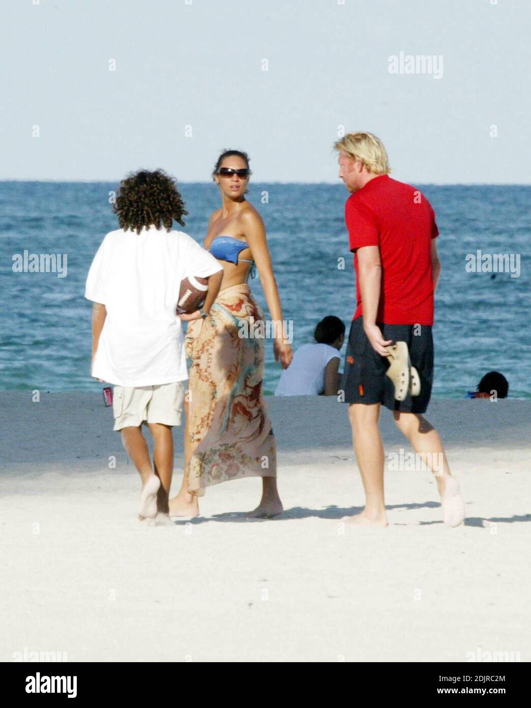 Sharlely Becker's gold bikini struggles to contain her post-baby curves and  almost lost her bikini top following a swim with Boris. Miami, FL. 9/3/10  Stock Photo - Alamy