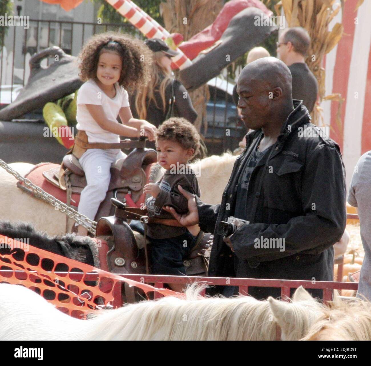 Heidi Klum and Seal take their growing brood to the Pumpkin Patch in West Hollywood, Ca. The children played with skeletons and ran around in a  bouncy pumpkin.  They even took a ride on ponies but the pair refused to get their faces painted. The family spent two hours in the Halloween hotspot before selecting a few pumpkins and heading home. 10/14/06 Stock Photo