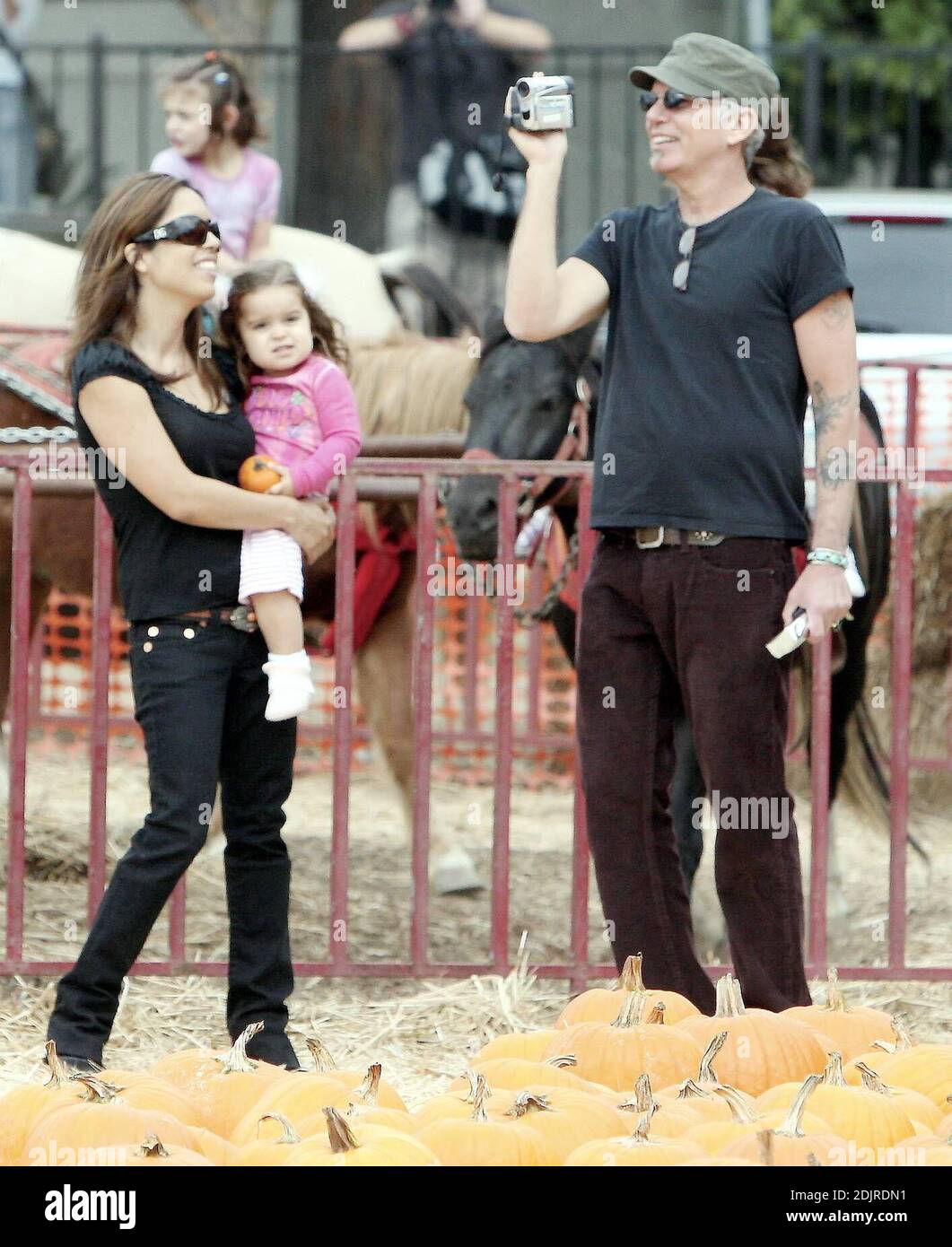 Billy Bob Thornton finds himself a 'nice round pumpkin' at the Pumpkin Patch in West Hollywood, Ca. where he visited along with his wife Connie Angland and daughter Bella. The family spent an hour selecting the prize pumpkin and Billy Bob shot video of most of the outing. 10/15/06 Stock Photo