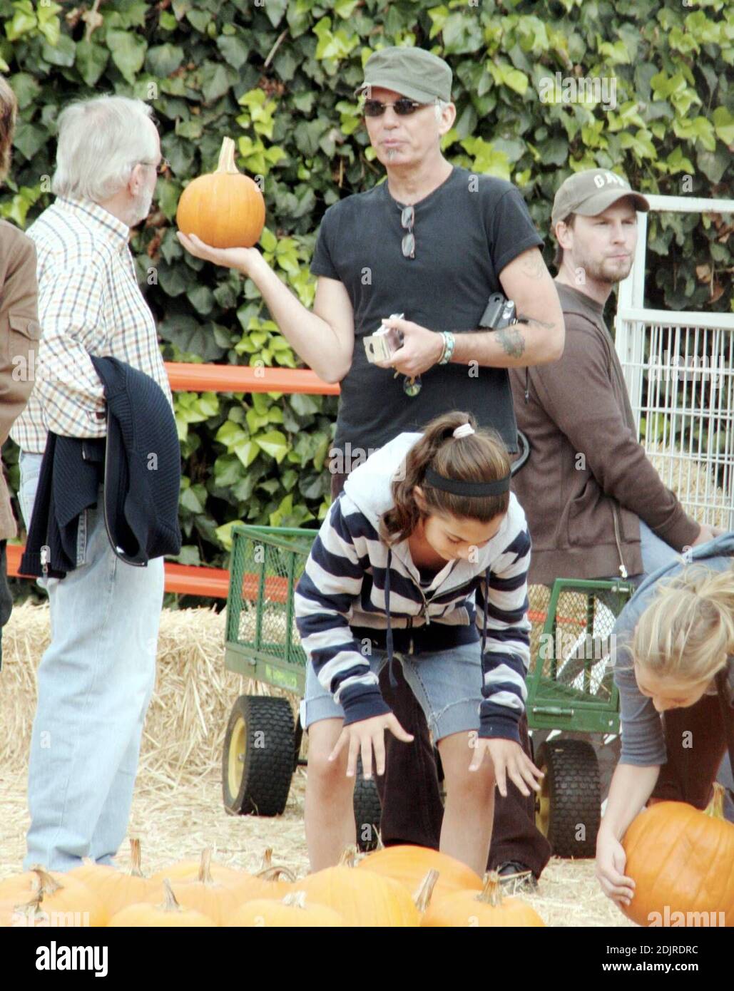 Billy Bob Thornton finds himself a 'nice round pumpkin' a the Pumpkin Patch in West Hollywood, Ca. along with his wife Connie Angland and daughter Bella. The family spent an hour selecting the prize pumpkin and Billy Bob shot video of most of the outing. 10/15/06 Stock Photo