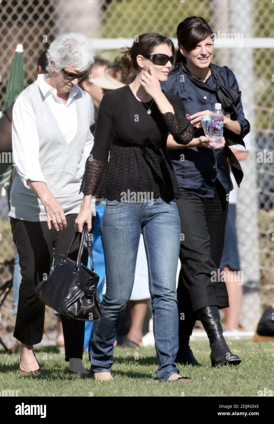 Katie Holmes makes another trip to the ball park, this time with her mother Kathy and one of her sisters. The trim looking actress told photographers she was excited about her upcoming wedding to Tom Cruise. 10/28/06 Stock Photo