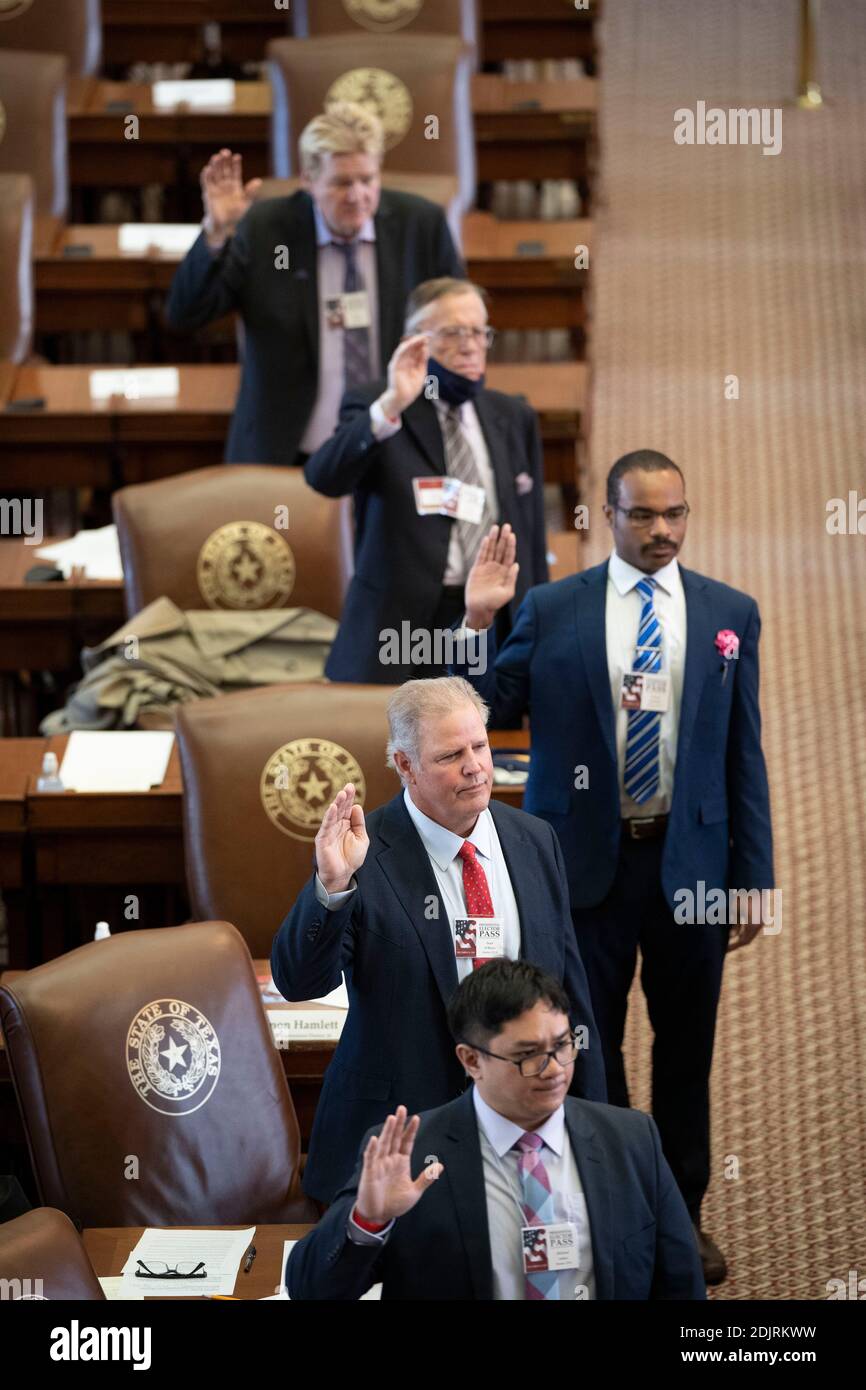 Austin, Texas, USA. 14th Dec, 2020. Texas presidential electors take the oath of office to cast ballots for President Donald Trump at the Electoral College vote Monday afternoon in the House Chamber. As expected, all 38 Texas votes went to Pres. Trump and Vice Pres. Mike Pence Credit: Bob Daemmrich/Alamy Live News Stock Photo