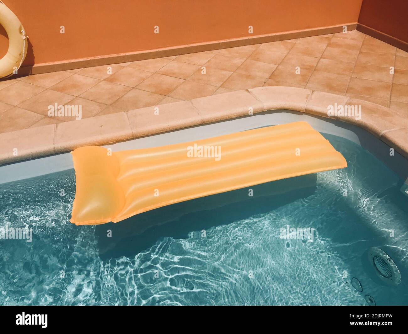 Yellow Inflatable Raft On Swimming Pool Stock Photo Alamy