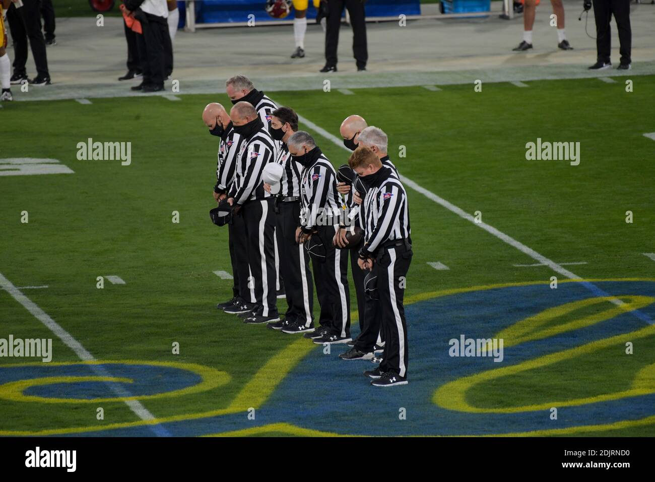 Pac-12 officials observe a message remembering the life of Rafer Johnson is seen before an NCAA football game between the Southern California Trojans Stock Photo