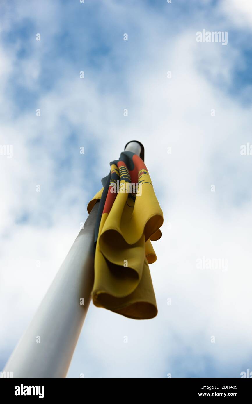 Low Angle View Of Flag On Pole Against Sky Stock Photo
