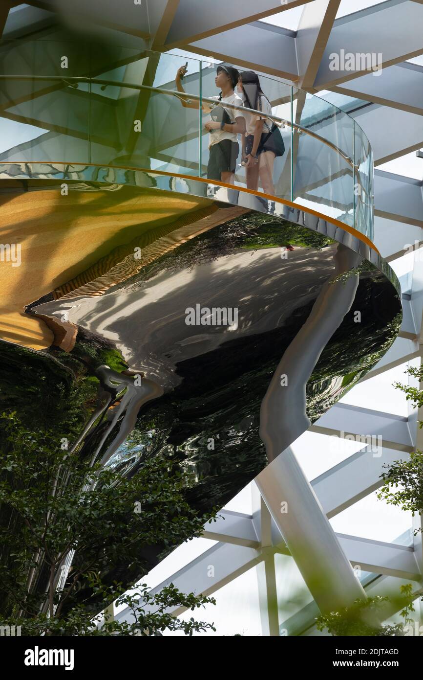 Singapore - October 21, 2019: Viewpoint with travelers and tourists at Singapore International Airport, Jewel Changi Airport building, surrounded by t Stock Photo