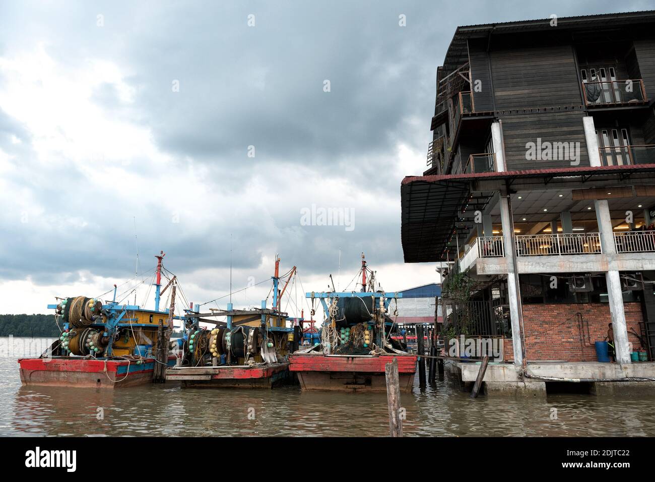 Kuala Sepetang, Malaysia- 27 Oct, 2018: The Kuala Sepetang Jetty with boats, and seafoods restaurant is a famous tourists stop, Perak, Malaysia. - Sce Stock Photo