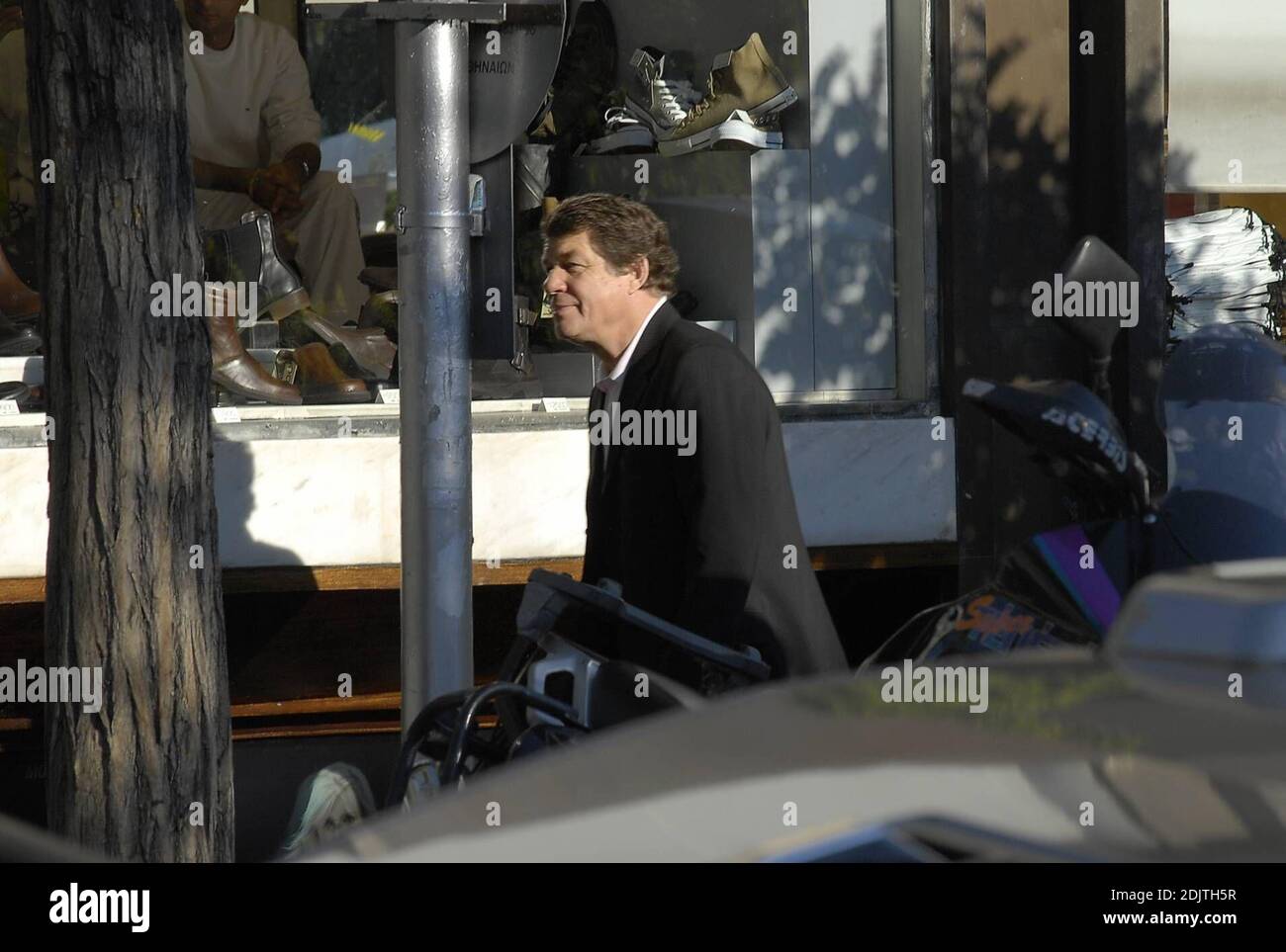 Greek soccer team coach Otto Rehangel does some shoe shopping in