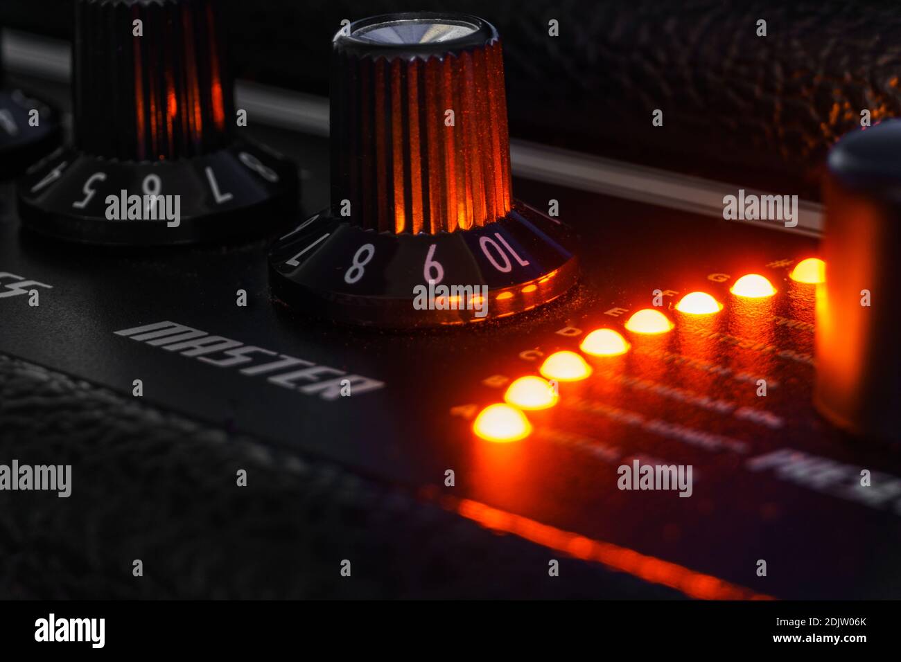 Detail of an amplifier for electric guitar with red lights Stock Photo Alamy