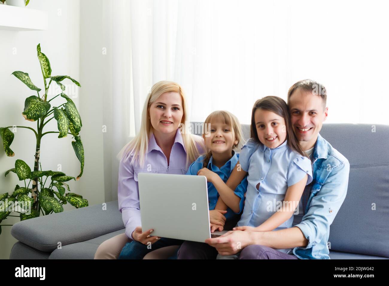 Family Working At Laptop With In Home Office Stock Photo - Alamy