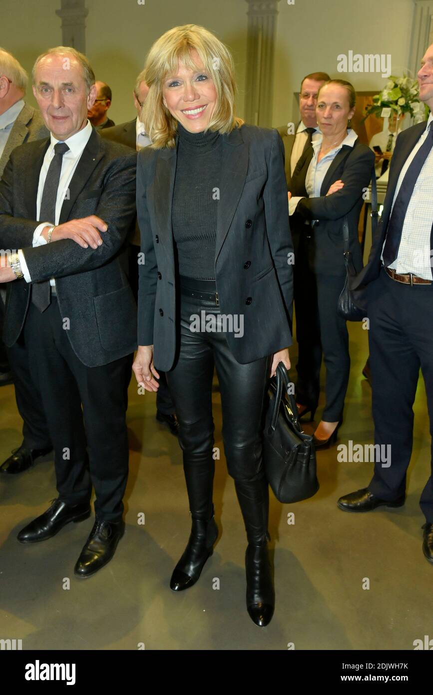 Brigitte Trogneux, wife of Emmanuel Macron. Former French Economy Minister,  founder and president of political movement 'En Marche !' and candidate for  the 2017 presidential election, Emmanuel Macron awards former CCI Picardy