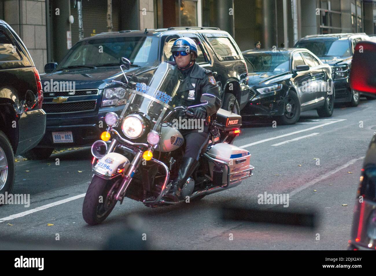 A NYPD motorcycle leads the motorcade for President-elect Trump as he ...