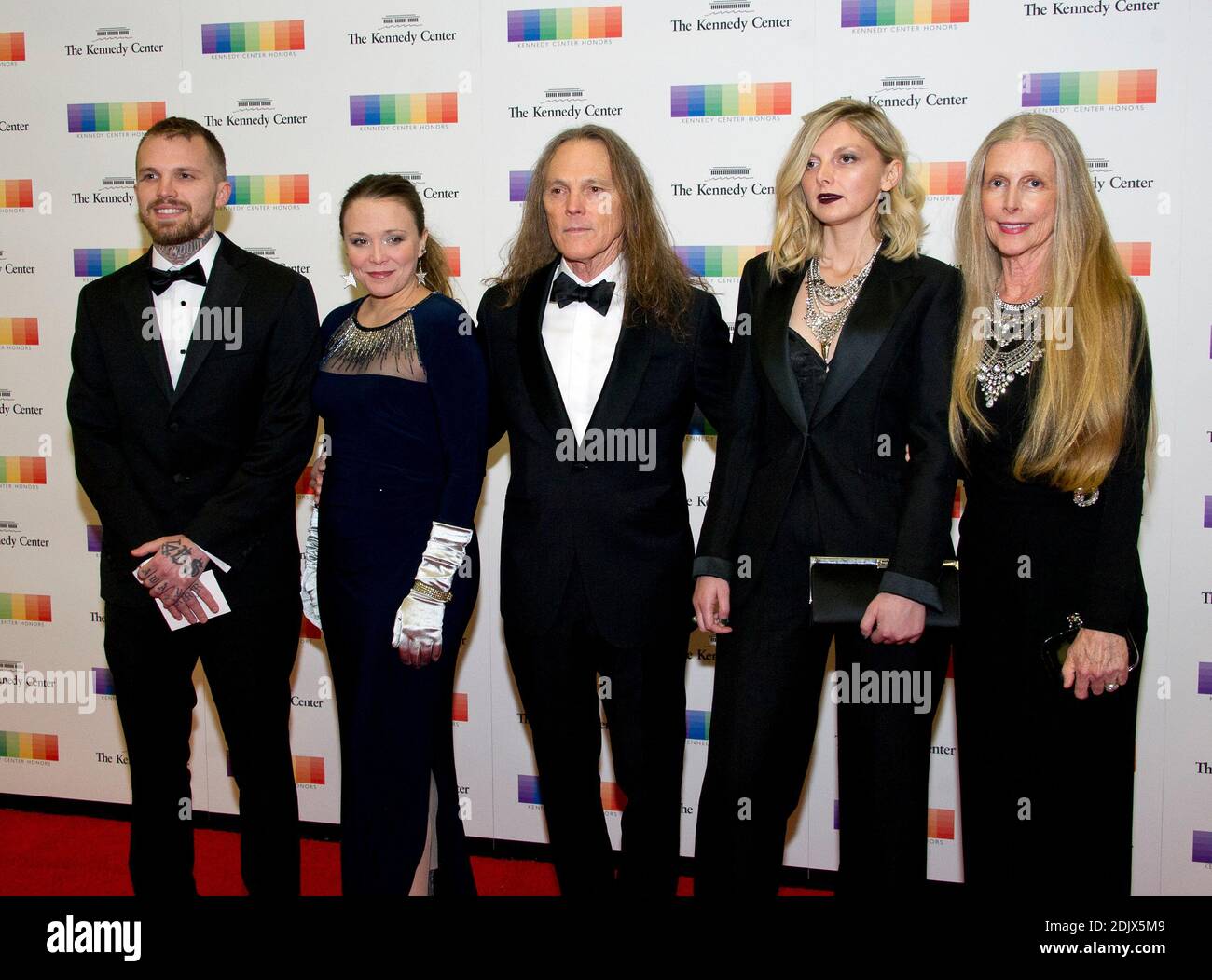 Timothy B. Schmidt, center, and his wife, Jean, right, arrive with