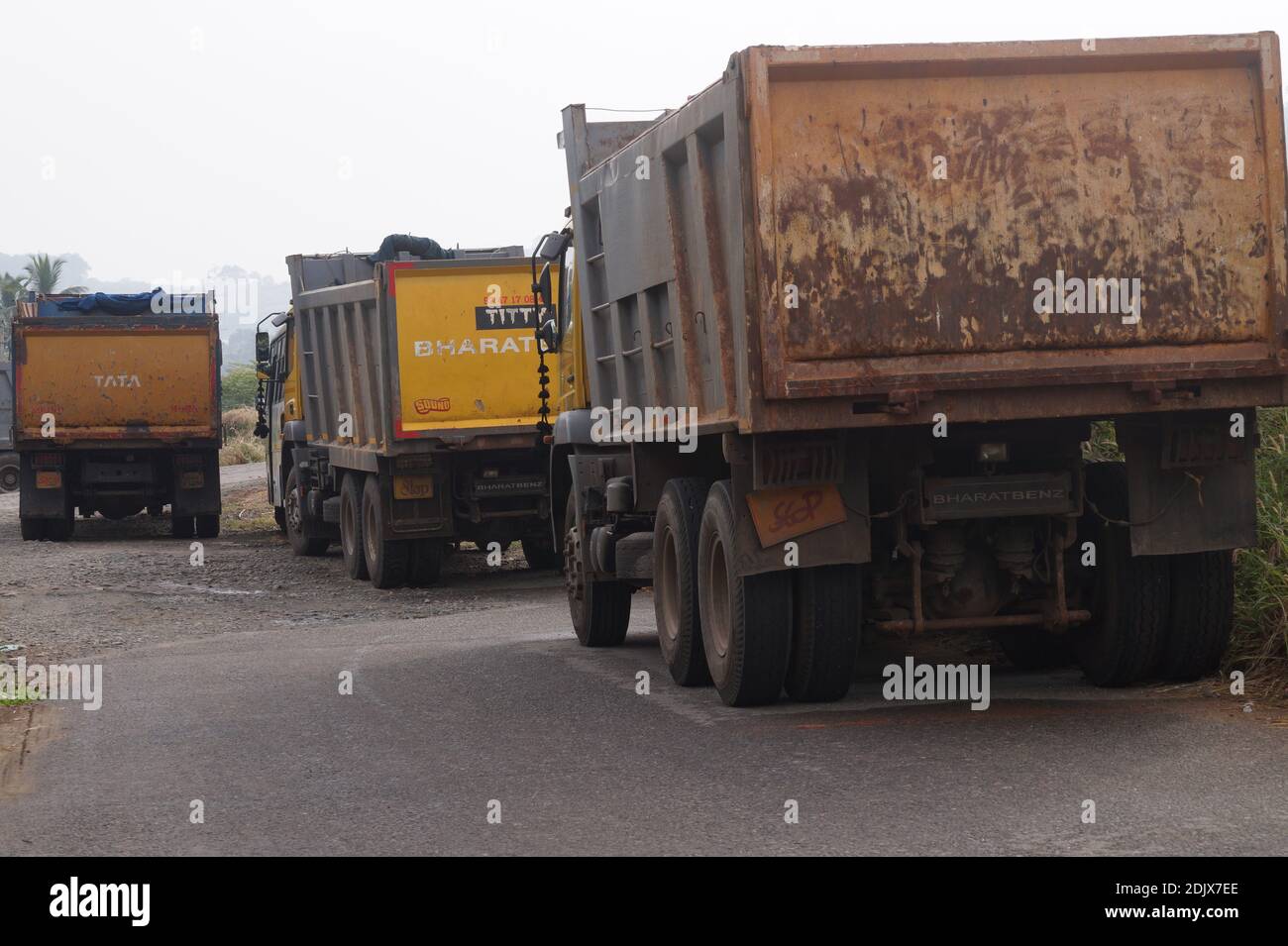 Thrissur, Kerala, India - 11-26-2020: Tipper lorries parked on the side of a road Stock Photo