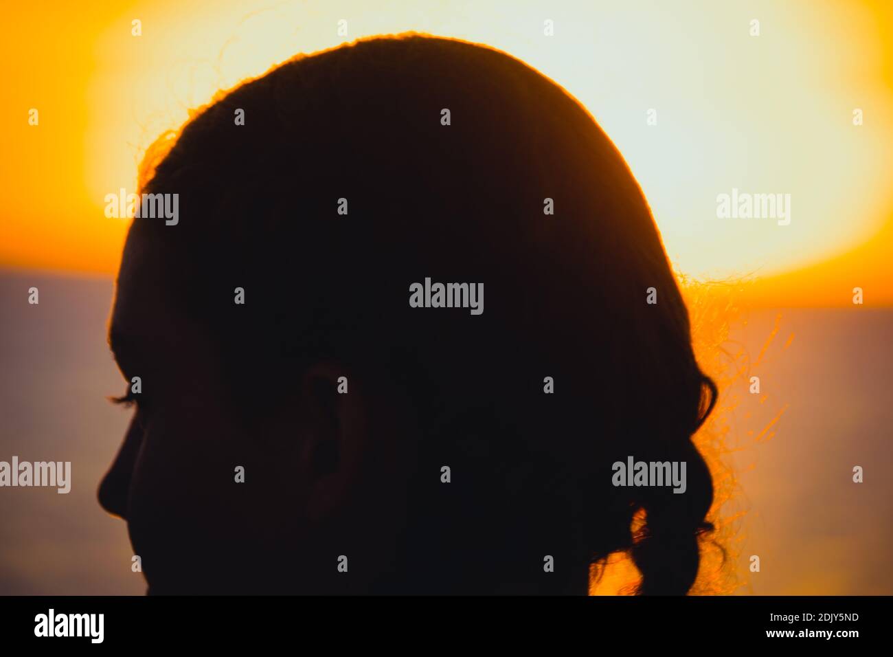 Close-up Silhouette Girl Against Sky During Sunset Stock Photo