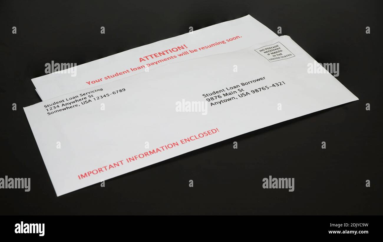 Student Loan Payments Resuming Notice in Envelope on Black Desk, left angled Stock Photo