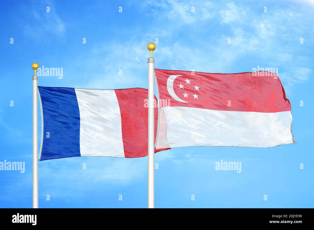 France and Singapore two flags on flagpoles and blue cloudy sky Stock Photo Alamy