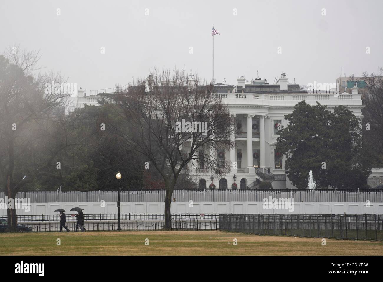 Washington, USA. 15th Dec, 2020. Photo taken on Dec. 14, 2020 shows the White House in the rain in Washington, DC, the United States. The U.S. Electoral College cast votes on Monday for a new president based on the 2020 election results, making Democrat Joe Biden's White House victory official. Credit: Liu Jie/Xinhua/Alamy Live News Stock Photo