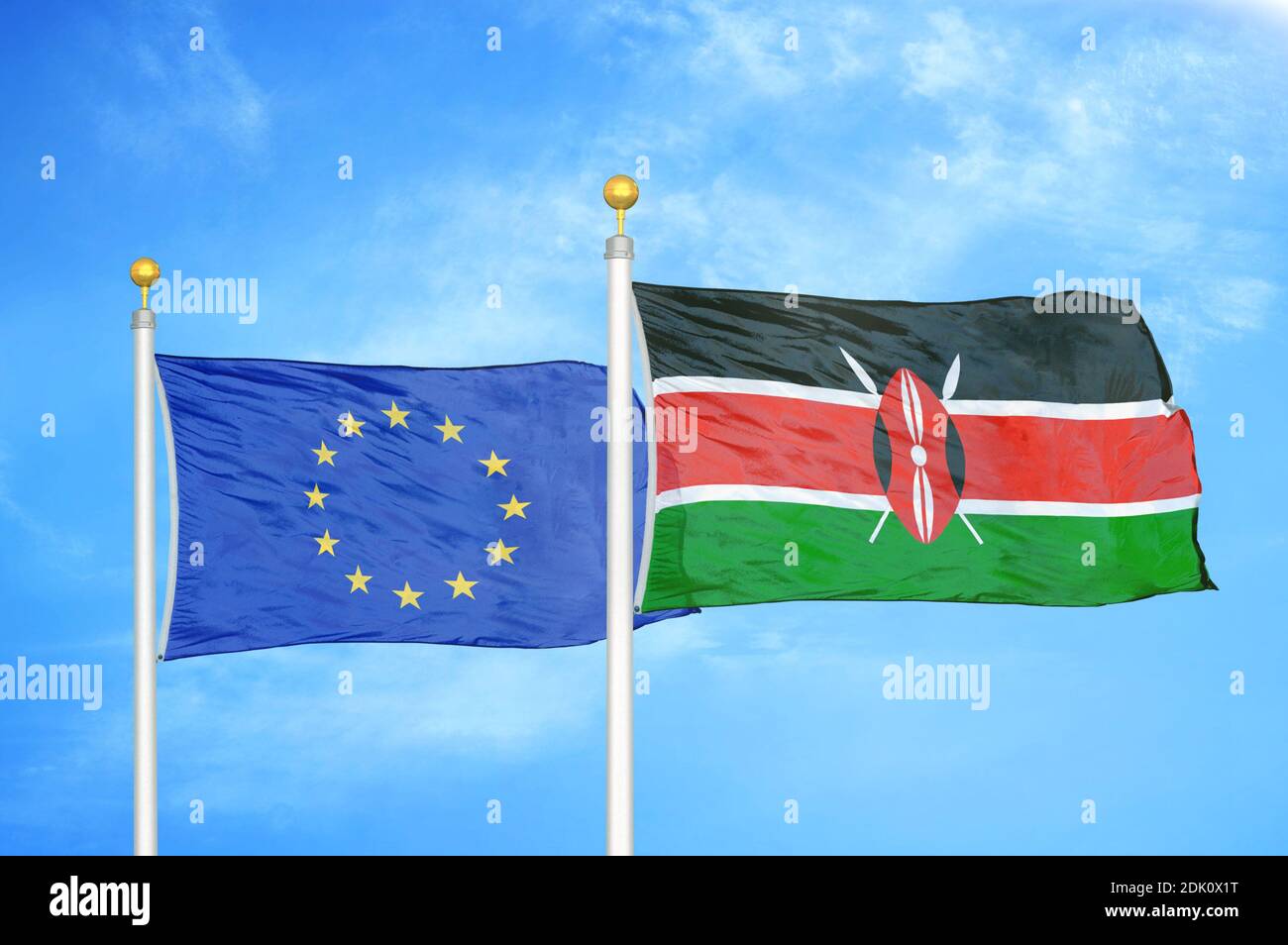 European Union and Kenya two flags on flagpoles and blue cloudy sky Stock Photo