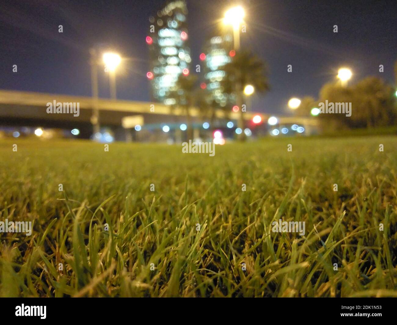 Illuminated Street Lights On Field In City At Night Stock Photo Alamy
